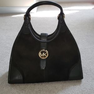 Suede shoulder bag with gold detail.